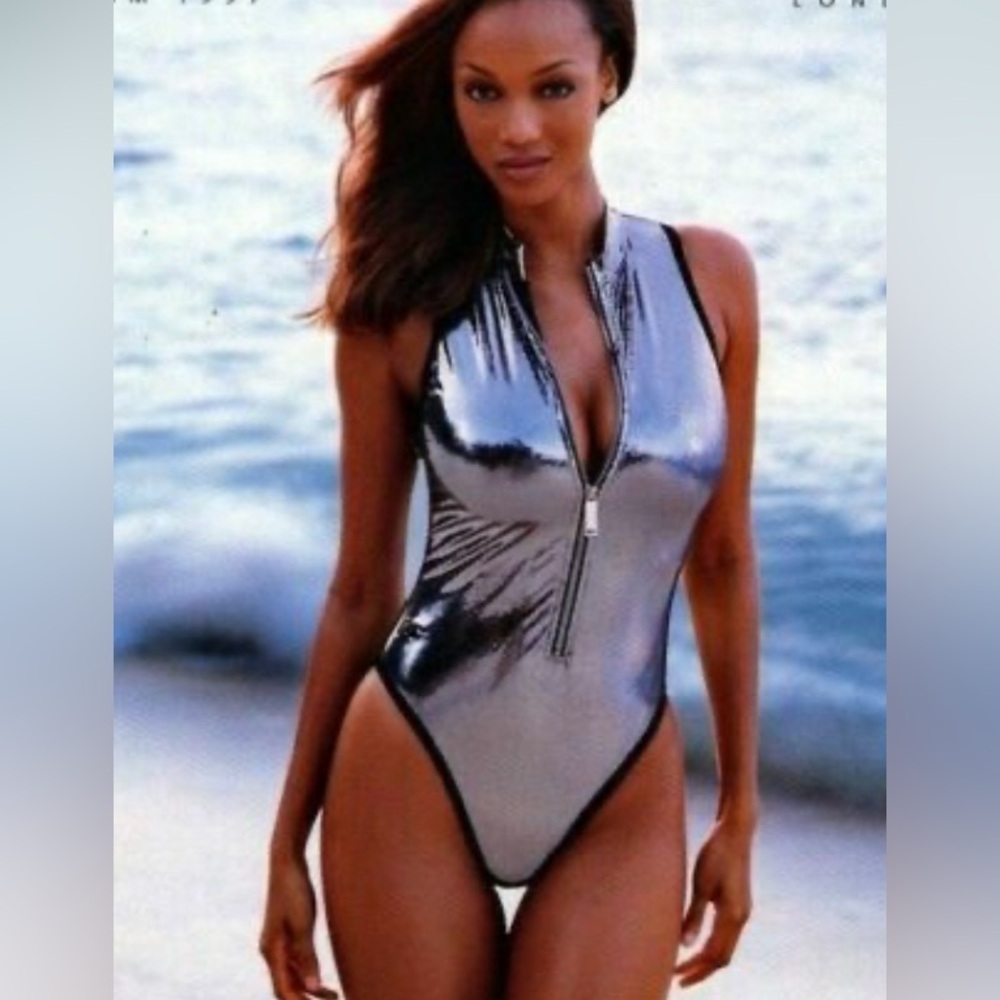 TYRA BANKS RARE silver speedo size 12. Zip front NEW OLD STOCK